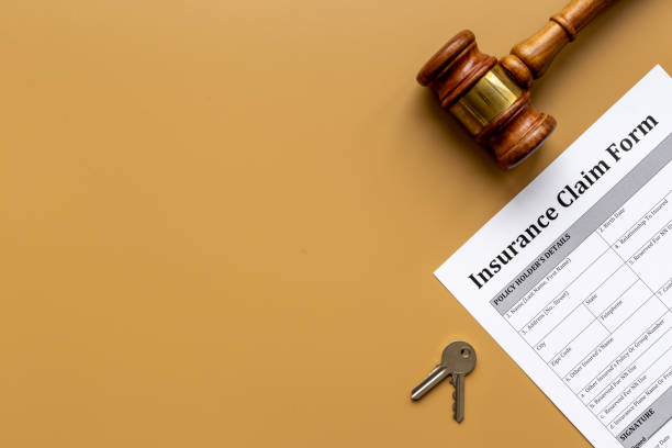 istock Insurance claim form with judge gavel . Top view 1309747645