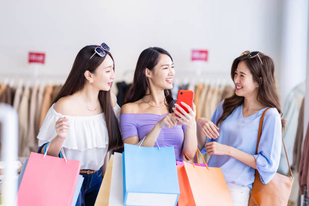 istock three women look at smartphone 1309749788