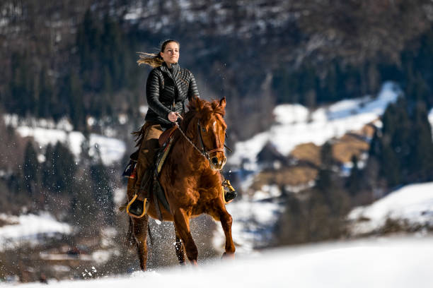 istock Cowgirl Horseback Riding 1309750128