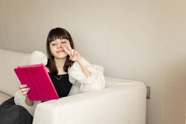 istock Teenage girl using digital tablet 1309750986