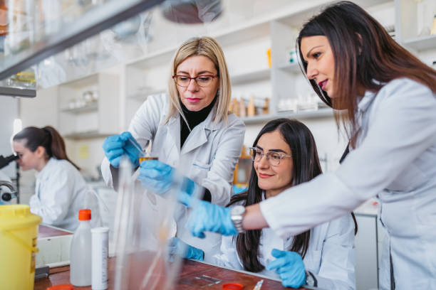 istock Teachers in medical school testing urine with students 1309752565