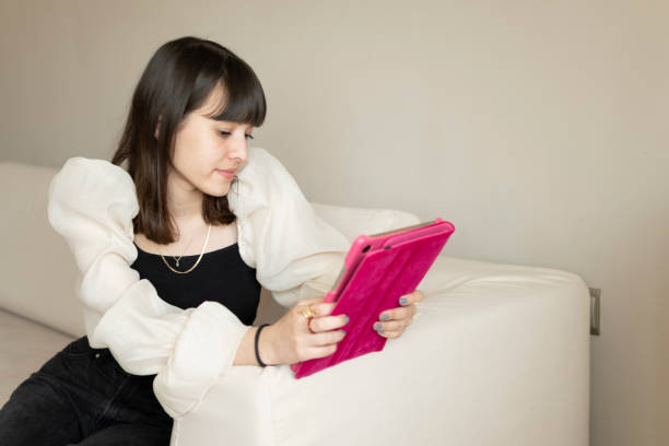 istock Teenage girl using digital tablet 1309753112