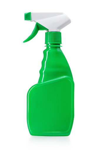Green spray bottle on white background