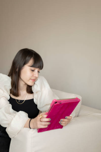 istock Teenage girl using digital tablet 1309753554