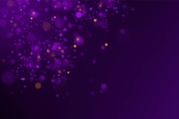 istock Sparkling magical dust and purple blue particles on black background. 1309754244