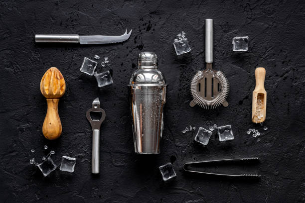 istock Set of cocktail drink tools and ingredients with shaker and ice. Flat lay 1309754940