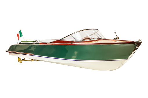 Front view of a two tone vintage Italian speedboat isolated on a white background