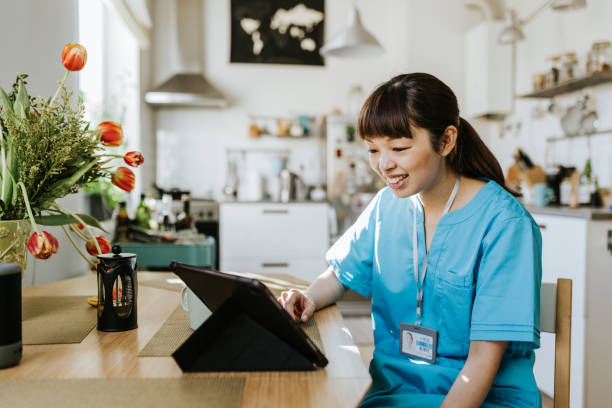 istock Healthcare worker on video call with a patient 1309755021