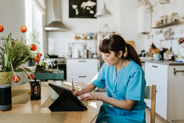 istock Healthcare worker on video call with a patient 1309755082