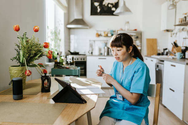 istock Healthcare worker on video call with a patient 1309755108