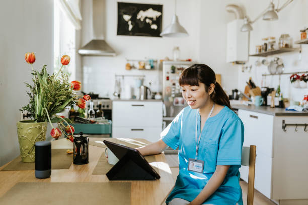 istock Healthcare worker on video call with a patient 1309755840