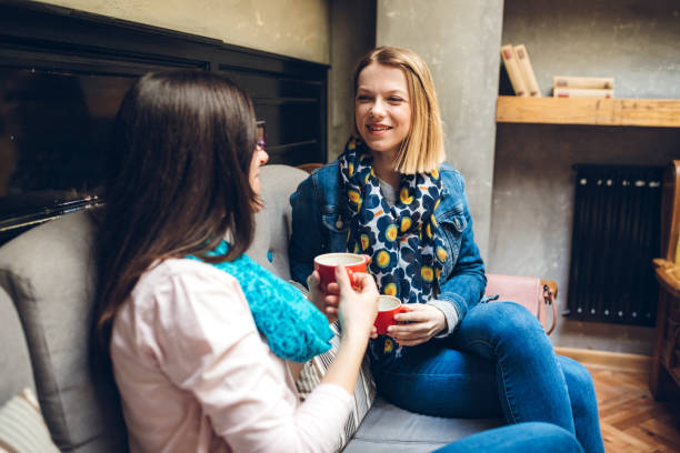istock Two female friends having coffee chat in cafe 1309758001