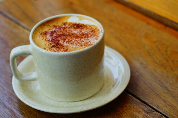 istock Coffee cup with milk in the morning 1309759049