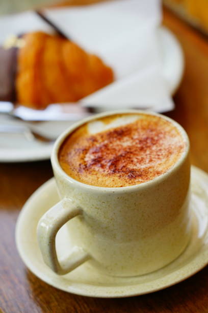 istock Coffee cup with milk in the morning and Croissant on table 1309759099