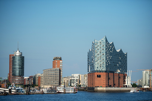 Hamburg, Germany - July 30, 2019: The skyline of the port city of Hamburg with the Elbphilharmonie. The concert hall by architects firm Herzog & De Meuron was opened in 2017.