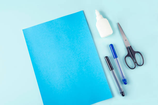 istock DIY and kids creativity. Step by step instruction: how to make shark from paper. Step1 preparation tools: scissors, glue, colored paper. Children Craft workshop 1309761836
