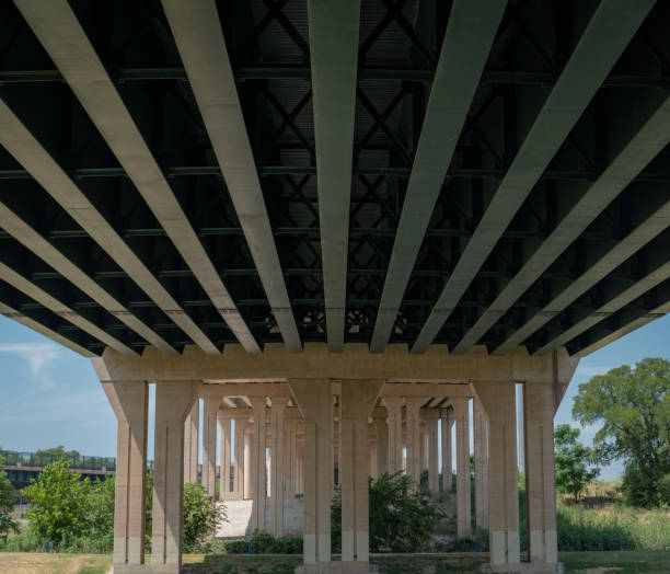 istock Lengthwise view underneath a bridge and its pillar supports 1309764152