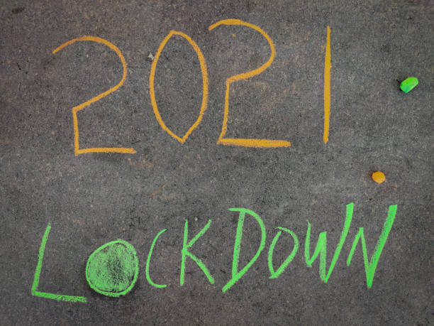 istock The inscription text on the grey board, 2021 lockdown . Using color chalk pieces. 1309764155