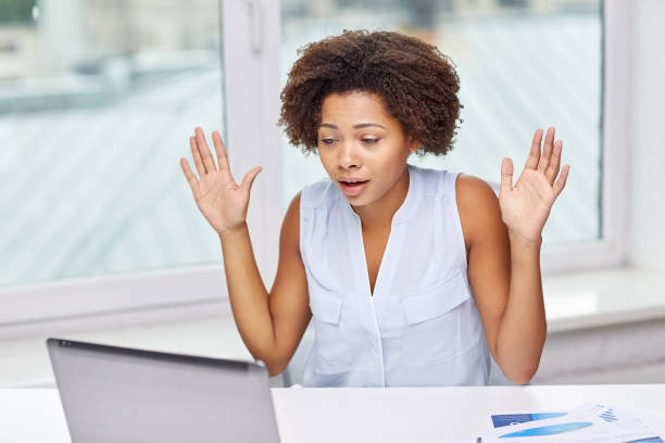 istock african woman with laptop at office 1309764283