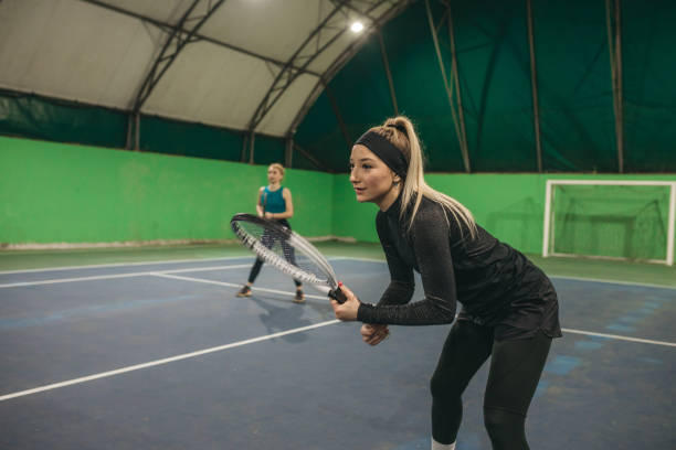 istock A young girls playing tennis 1309767016