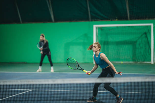 istock A young girls playing tennis 1309767031