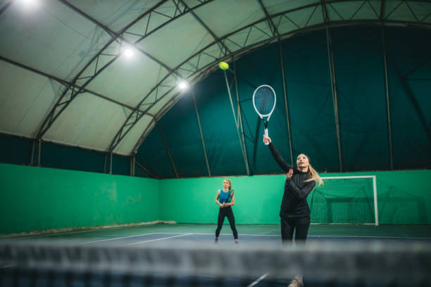 istock A young girls playing tennis 1309767033