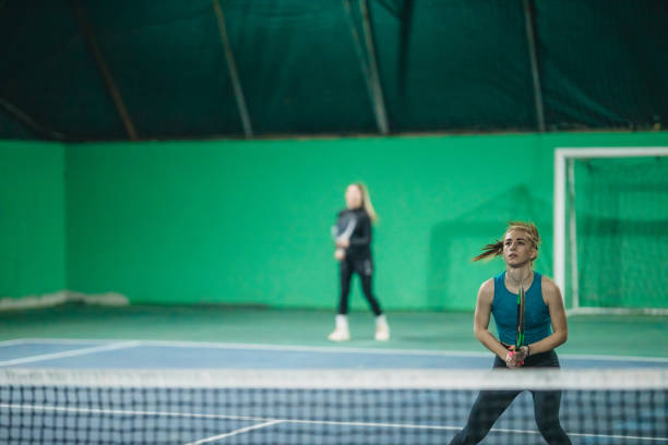istock A young girls playing tennis 1309767035