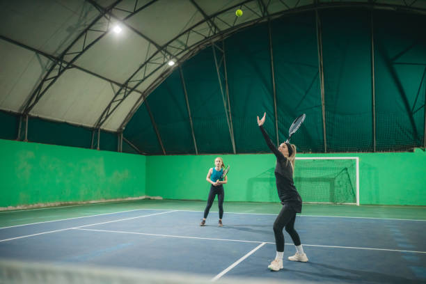 istock A young girls playing tennis 1309767048