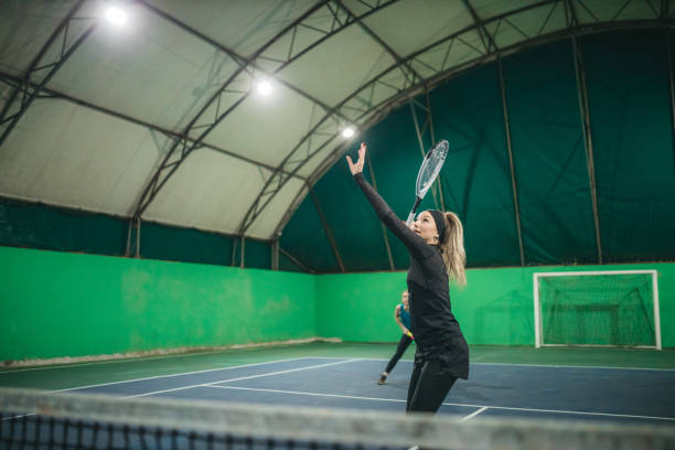 istock A young girls playing tennis 1309767065