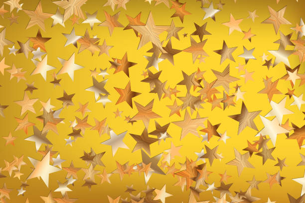 istock Stars golden glitter confetti isolated on blurred abstract yellow background. Festive holiday background. Celebration concept. Falling magic gold  particles. Invitation mock up. Top view, flat lay 1309767454