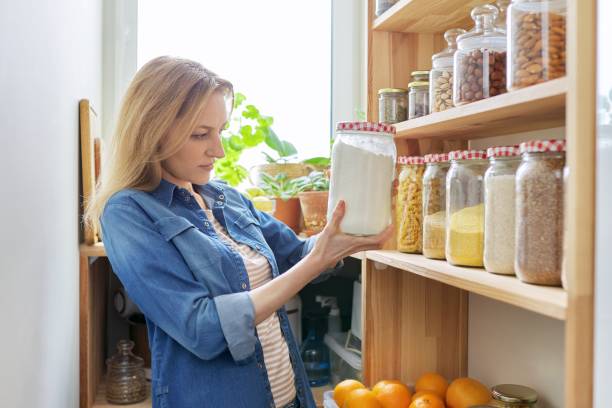 istock Middle aged woman at home in kitchen in pantry 1309770629