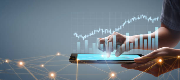 istock Graph growth and increase of chart positive indicators in his business, tablet in hand 1309771372