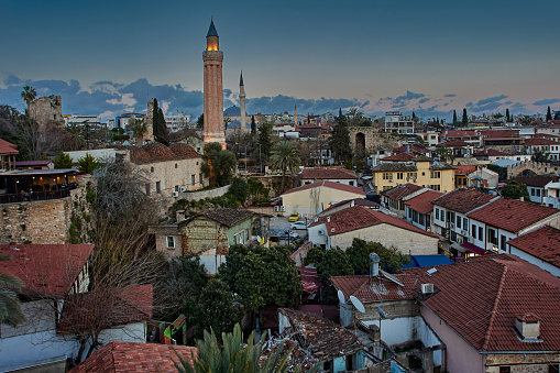 View of tiled roofs of old city in Antalya in blue hour in spring.