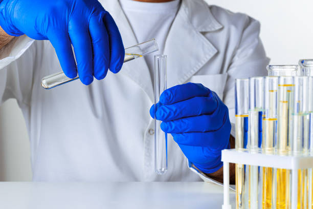 istock Close up of hands of a scientist working with laboratory samples 1309772527