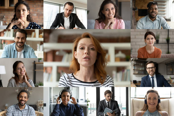 istock Focused young red-haired female employee talking with colleagues online. 1309773555