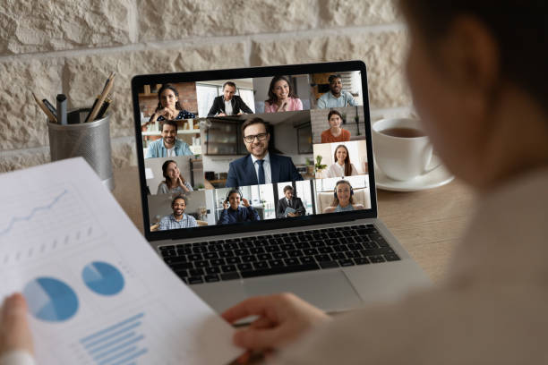 istock Female employee discussing working issues with diverse colleagues online. 1309773558