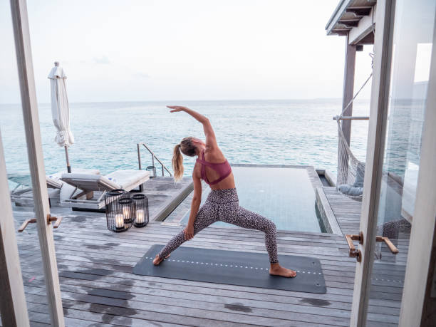 istock Woman exercising yoga inside luxury private villa 1309773584
