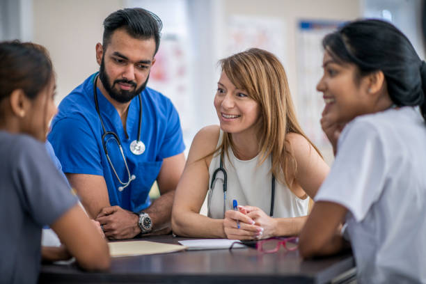 istock Medical Students In A Meeting Together 1309776270