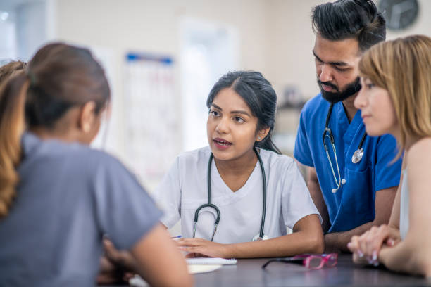 istock Multi Ethnic Doctors and Nurses In A Discussion Together 1309776276