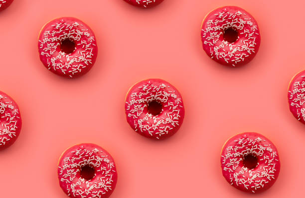 istock Pattern with tasty donuts on pink background. Mock up template for bakery 1309777814