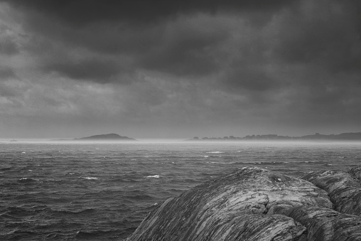 Swedish west coast archipelago. Silhouette of the island of Hyppeln. Windy Kattegat sea