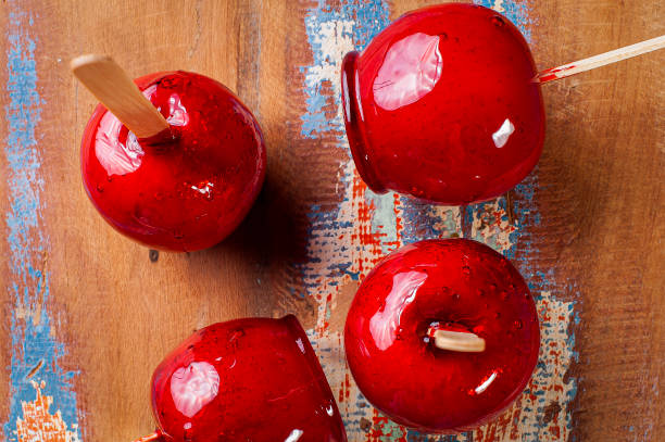 istock Love Apple. Red caramel covered apple dessert 1309782600