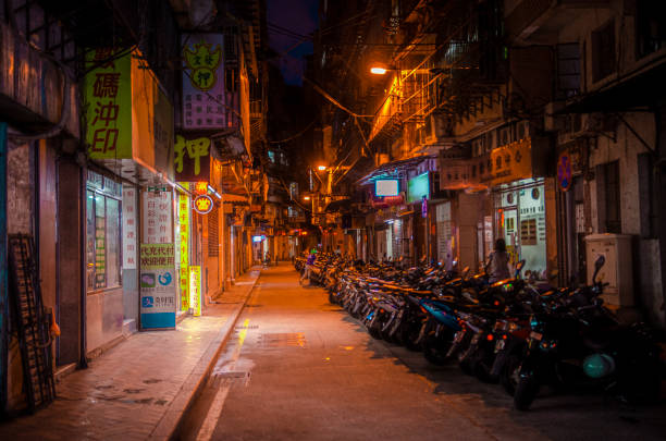 istock rack of motorcycles night alley 1309782749