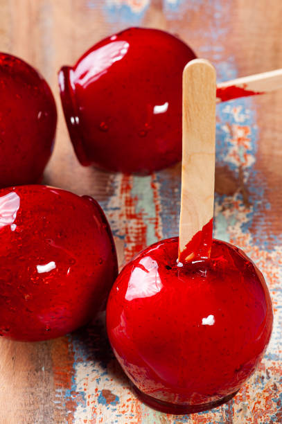 istock Love Apple. Red caramel covered apple dessert 1309782766