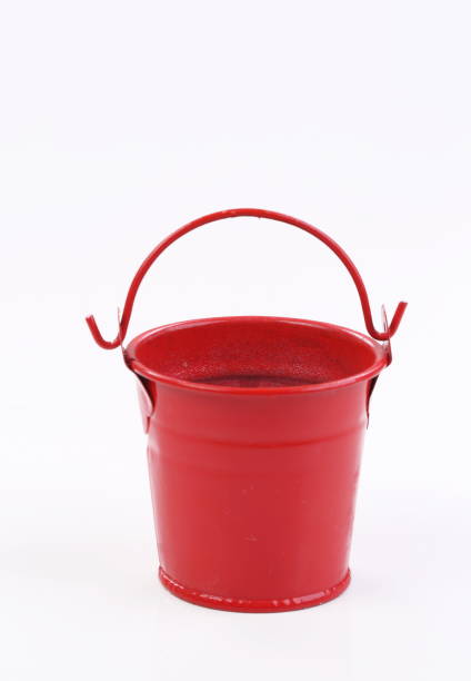 istock Red metal bucket decorative isolated on white background 1309782781