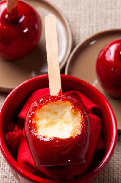 istock Love Apple. Red caramel covered apple dessert 1309782893
