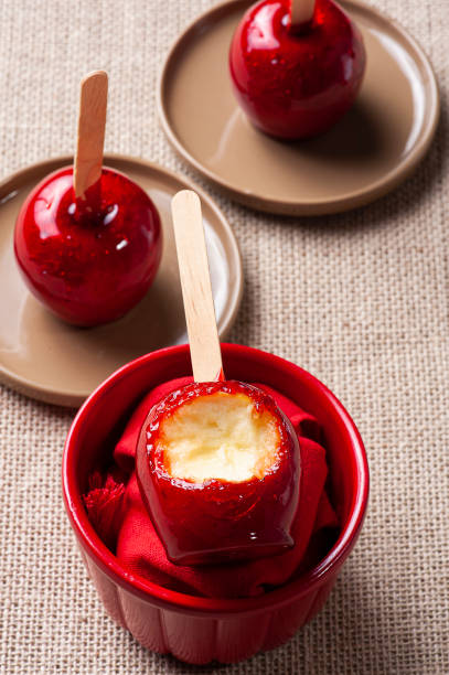 istock Love Apple. Red caramel covered apple dessert 1309782895