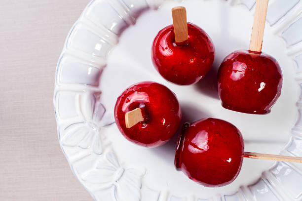 istock Love Apple. Red caramel covered apple dessert 1309782898