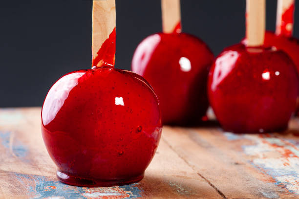 istock Love Apple. Red caramel covered apple dessert 1309782899