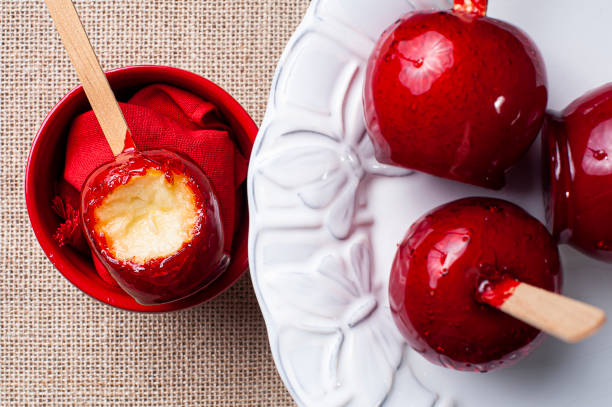 istock Love Apple. Red caramel covered apple dessert 1309783011